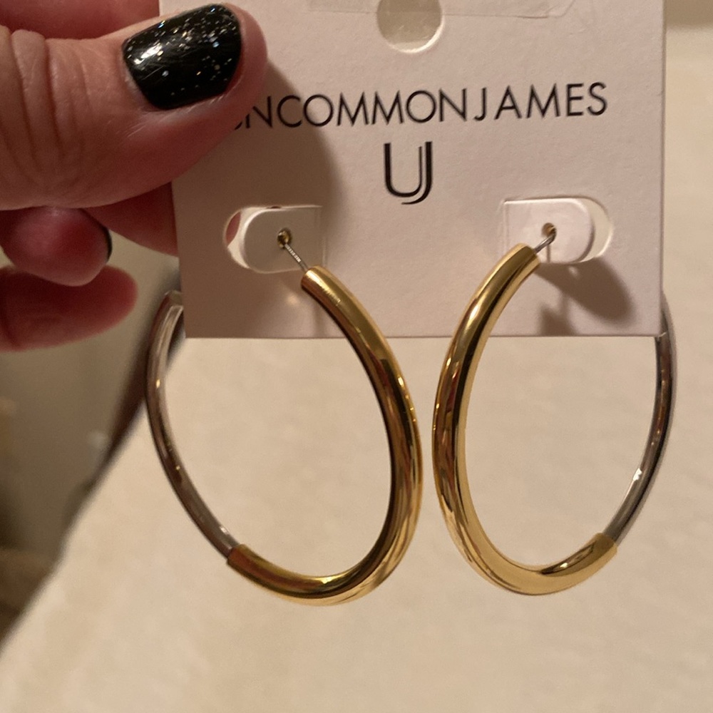 Brand New UJ silver/gold hoops. They come with box and pouch. Hoops 2 inches